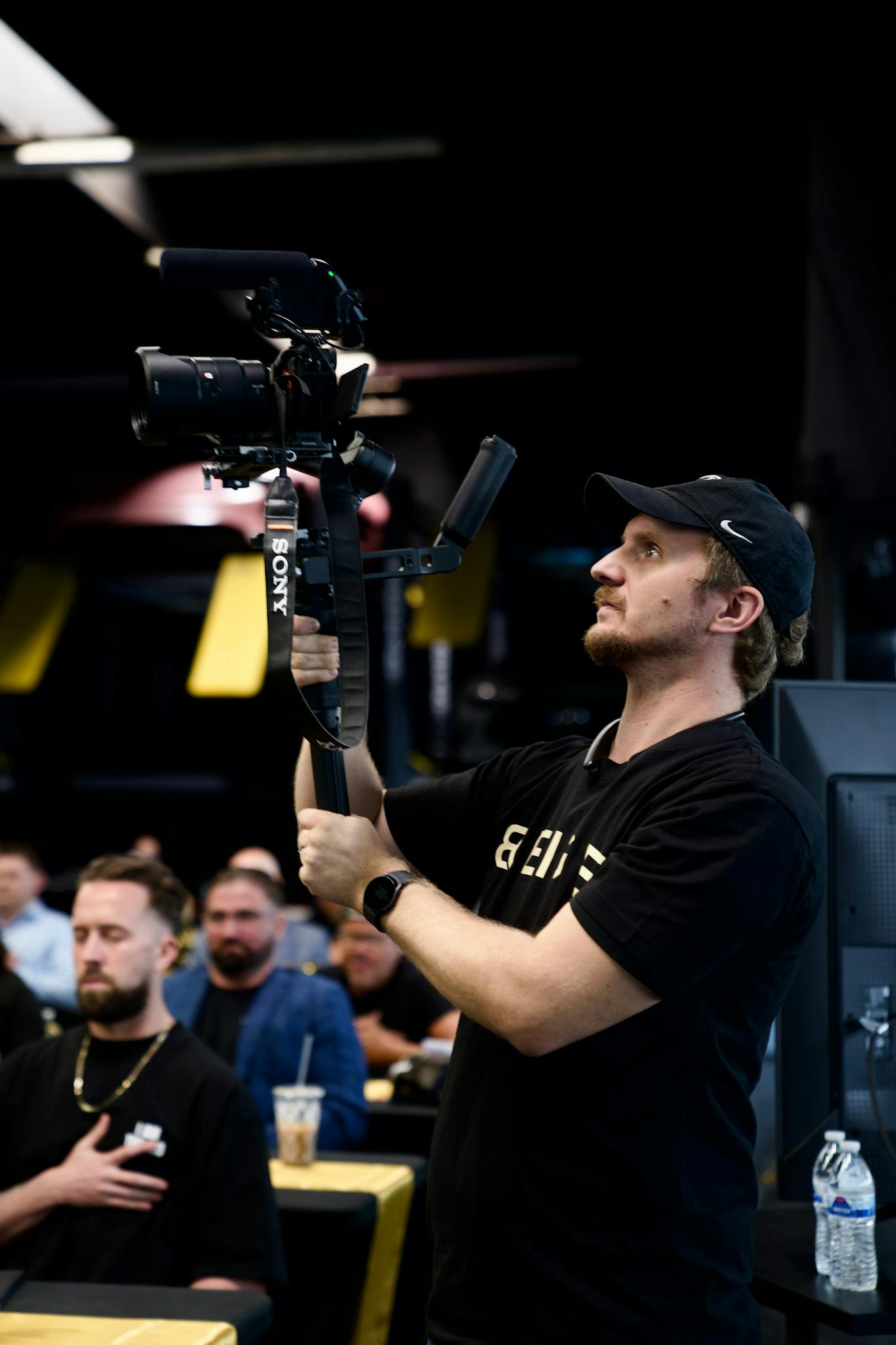 Videographer capturing a live event in Los Angeles, expertly handling the camera.